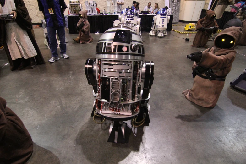 an image of an iron robot in the middle of a room