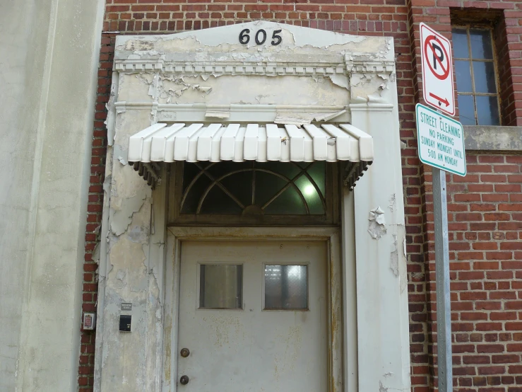 an old building with no entry door and brick facade