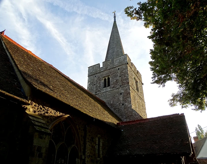 the outside of an old church with a clock tower