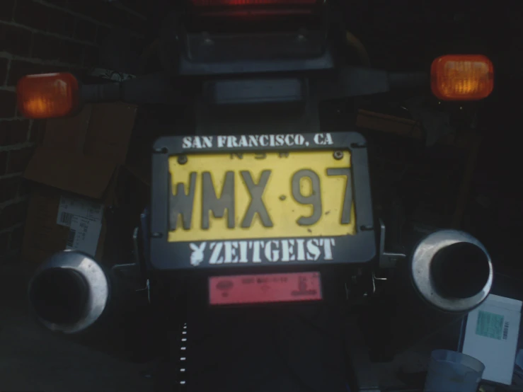 the front of a motorcycle has an x - 9 license plate