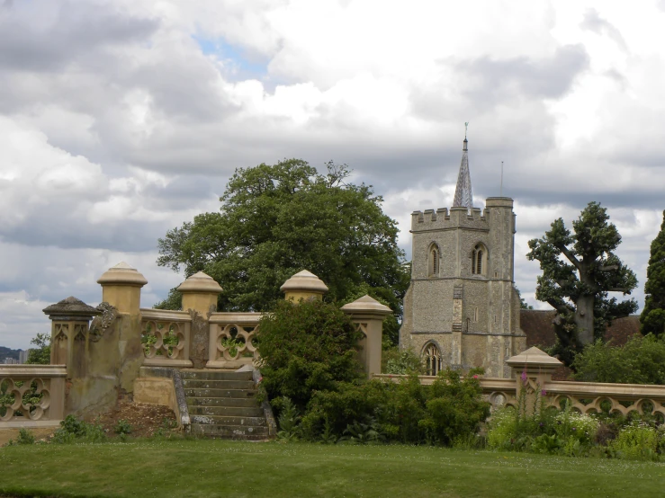 an old building with a clock tower near the bridge