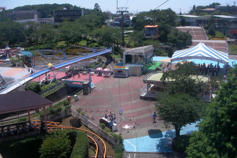 an aerial view of people at an amut park