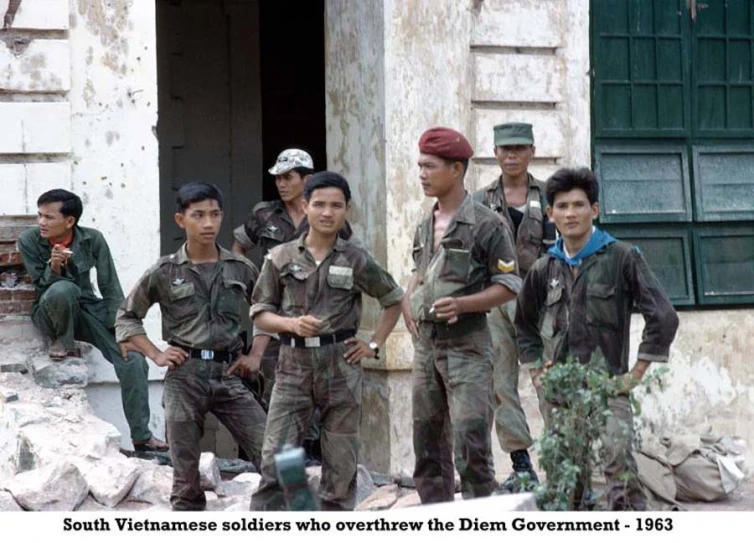 several soldiers standing in front of a building