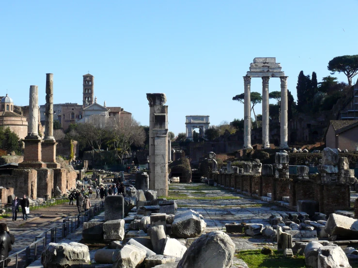 people are standing among ruins and stones in the ruins of a city