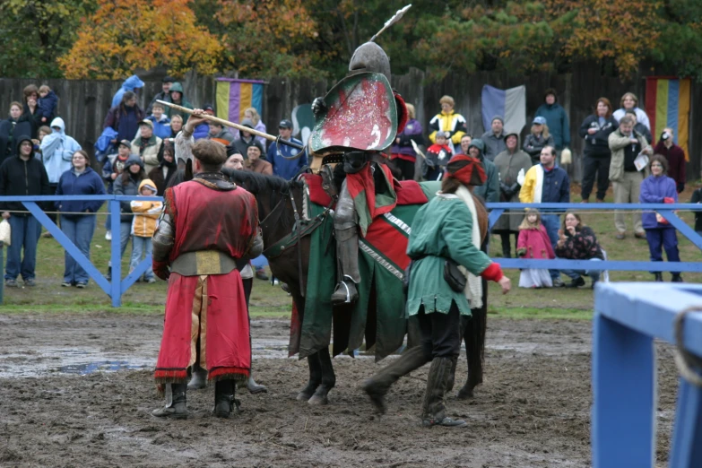 people wearing knights clothes and masks walking around