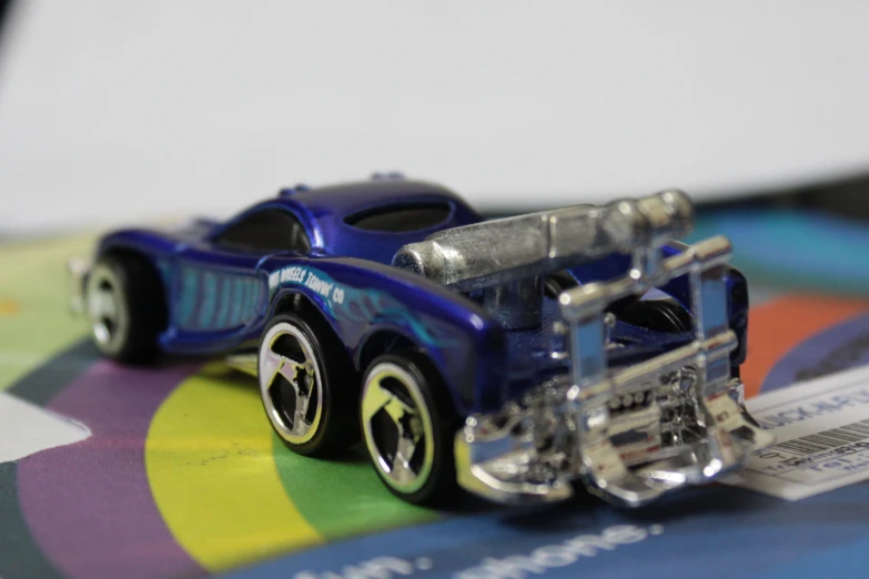 a close up of a toy car on a colorful surface