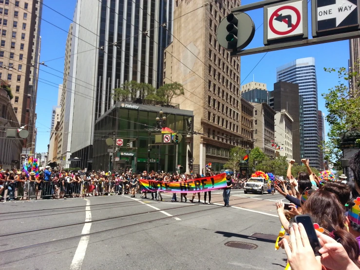 a parade that is going through a busy intersection