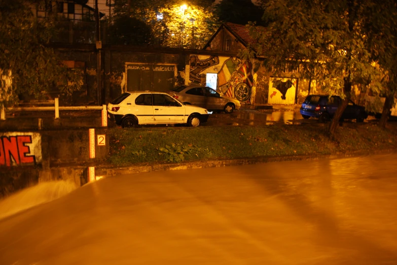 a white car parked in a driveway at night