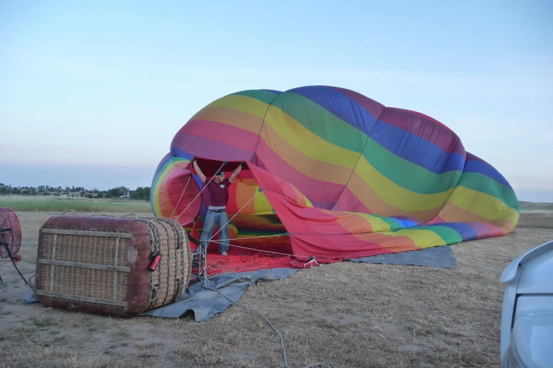 a man holding the strings to his  air balloon