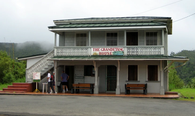 a man and woman standing outside a restaurant