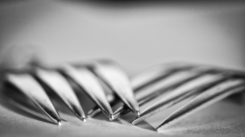 a couple of knives are sitting on a table