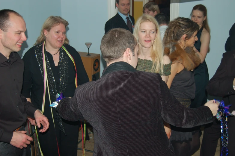 a group of young people standing around each other