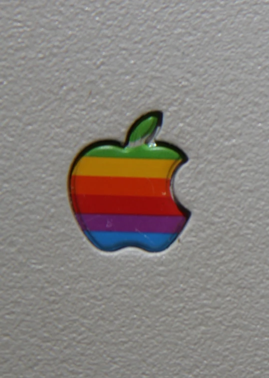 an apple logo on the side of a laptop