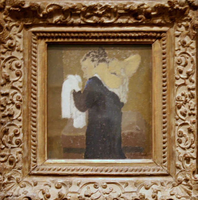 a painting of a woman is in a ornate gold frame