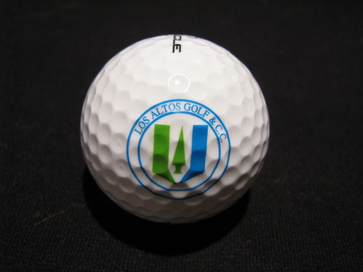 a close up of a golf ball with the u s open logo