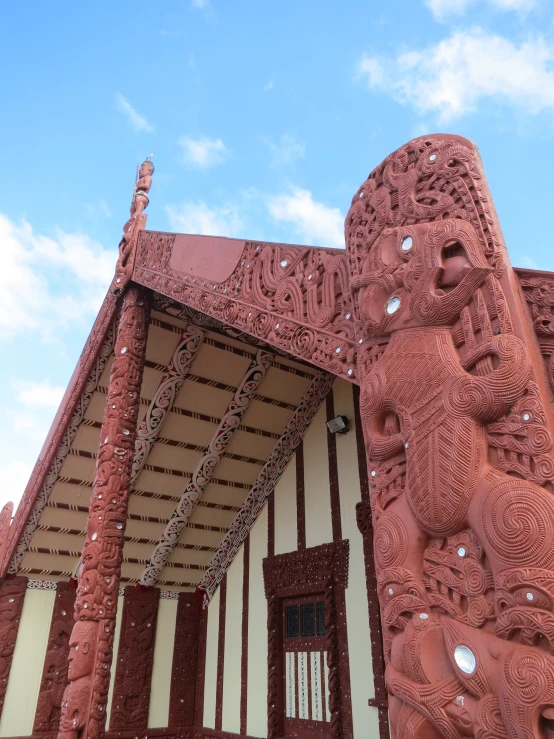 a building with intricate carving depicting a lion in the center