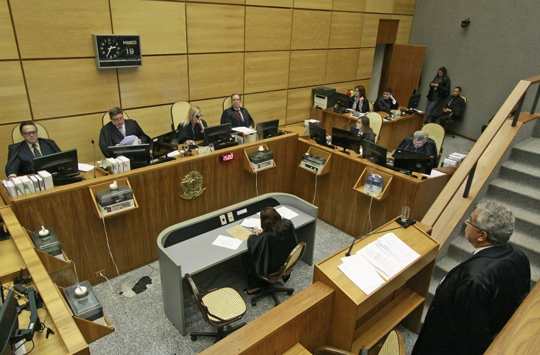 a meeting room with people waiting in rows