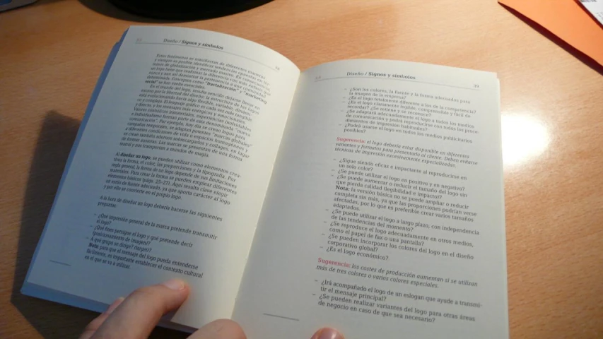 an open textbook with hand writing on it