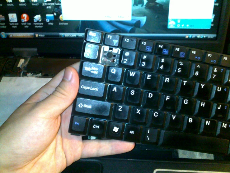 this is a keyboard on the palm of someone's hand