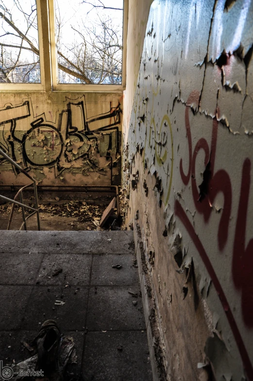 a view of graffiti on the walls of a rundown building