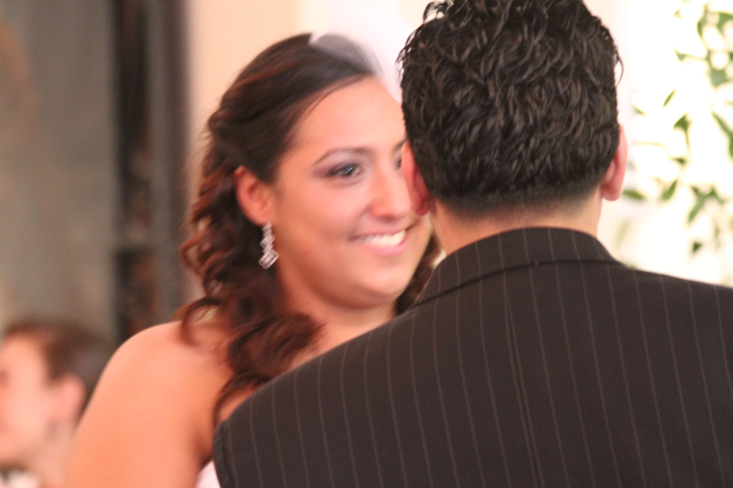 a woman in a dress and man in a black suit at a dance