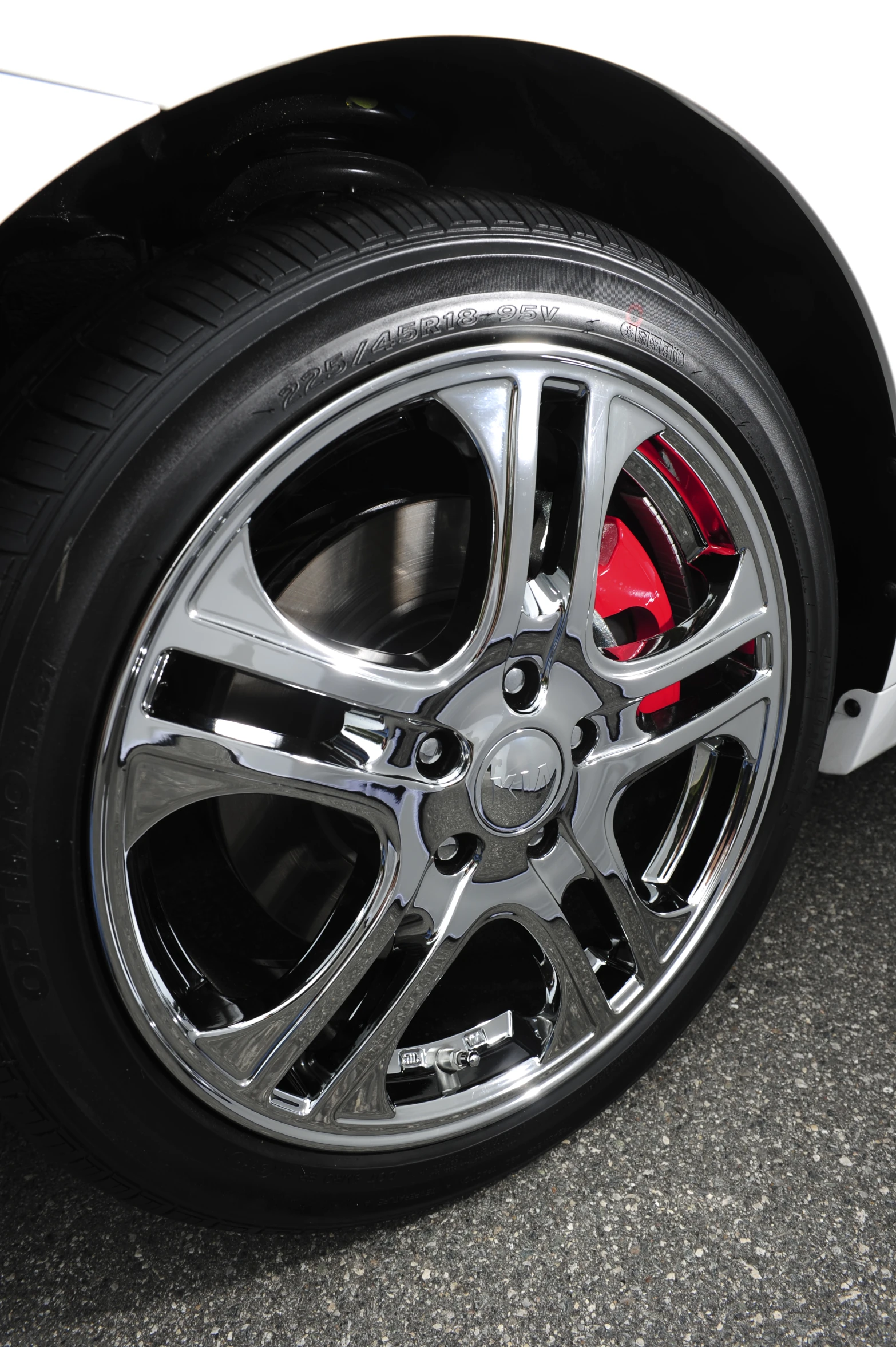 close up of a silver and red tire