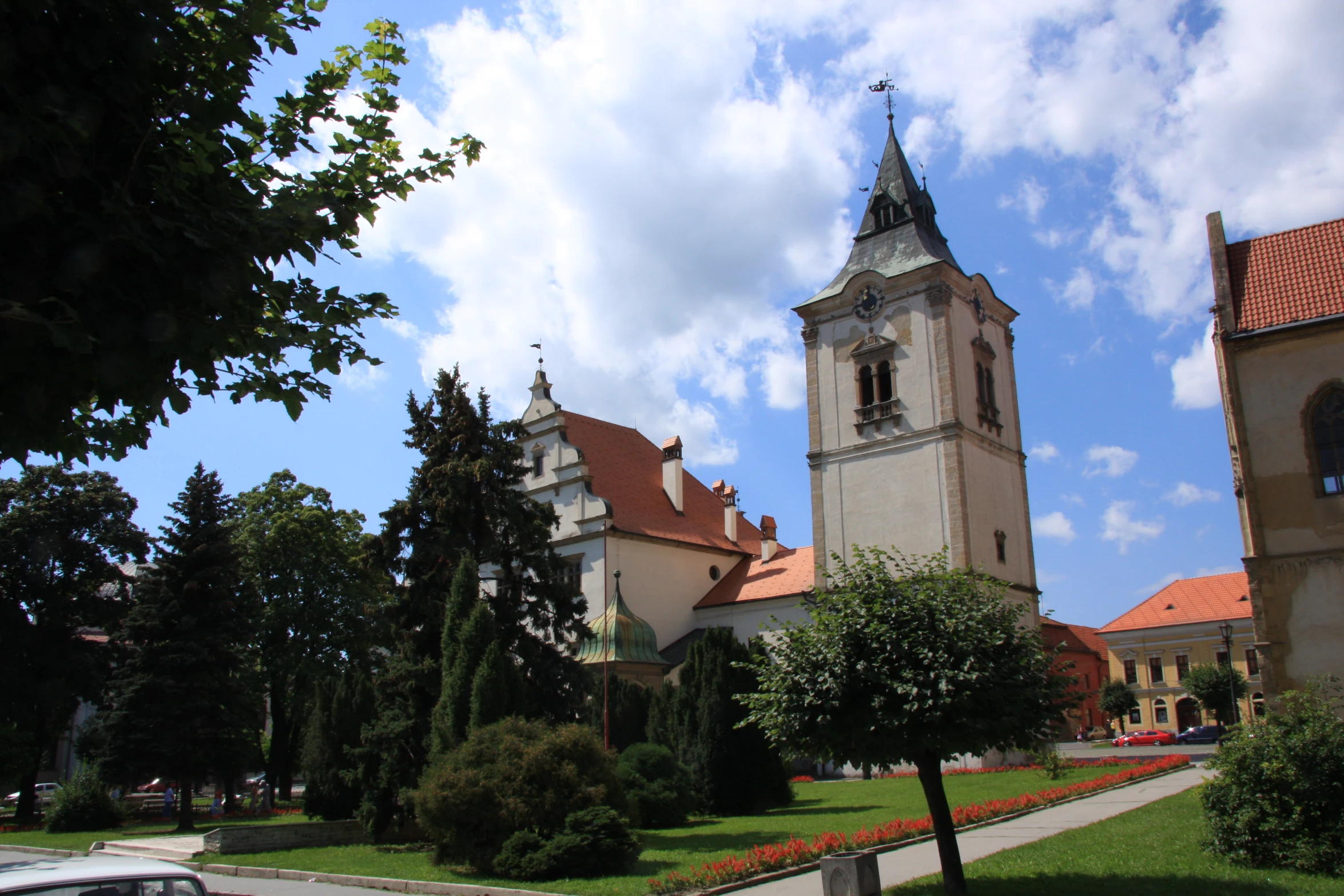 a church with a tower and a white clock on it