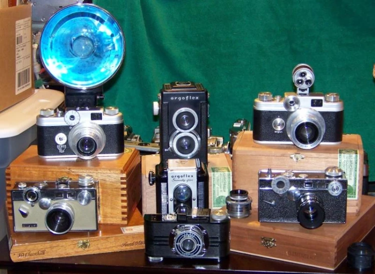 cameras are shown on different wooden boxes