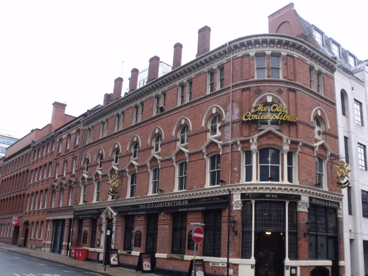 a large brick building that has a store front