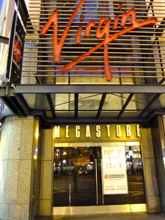 an entrance to a restaurant with neon letters