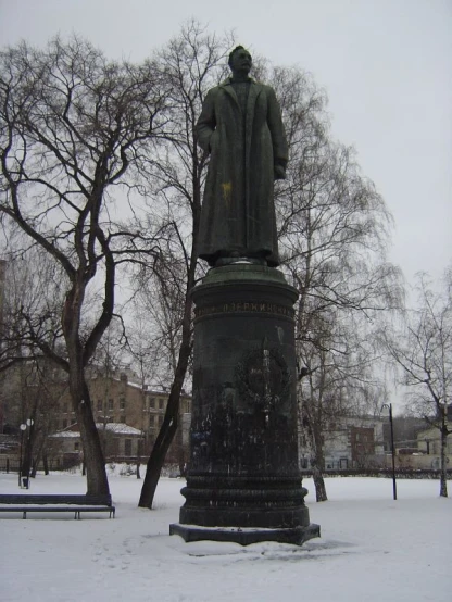 a statue with a long robe and a coat