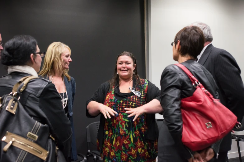 a group of people standing in a room