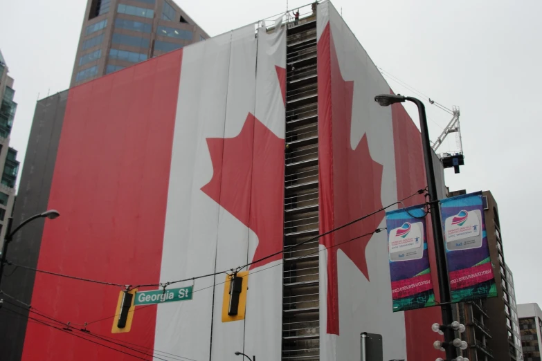 a red and white building with a flag painted on it