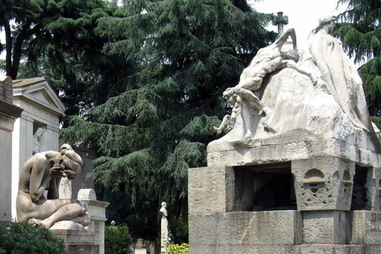 a very ornate stone statue with a man falling asleep