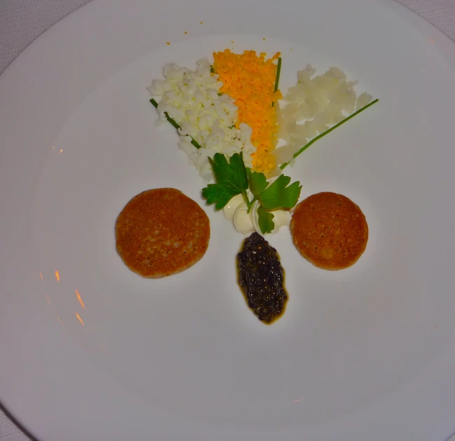 three pieces of food on a white plate