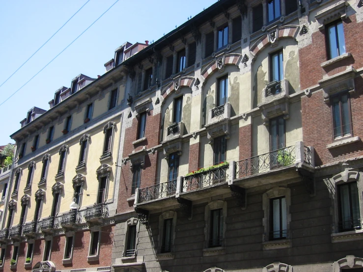 an old building has balconies on each window