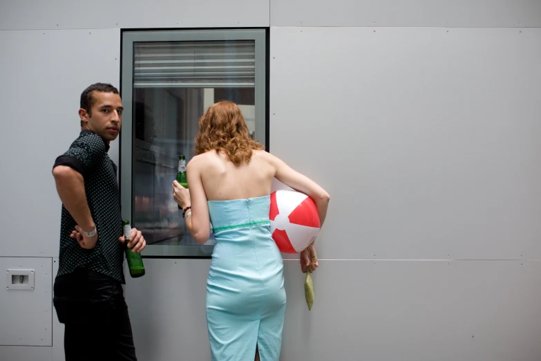 a couple stands outside in a building talking