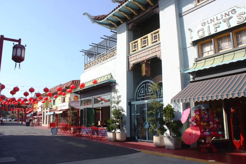 an asian street with lots of red lanterns