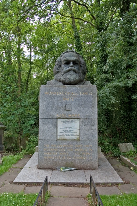 a monument with a bust in the middle