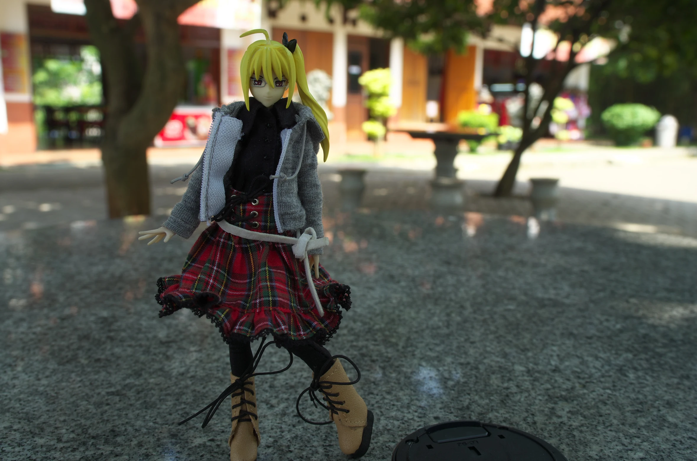 a doll that is standing next to a big bowl