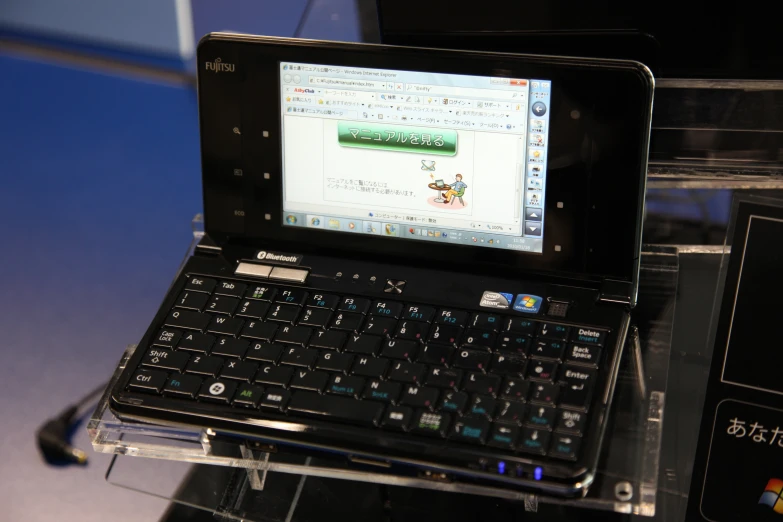 a smart tablet with a keyboard attached to the back of it