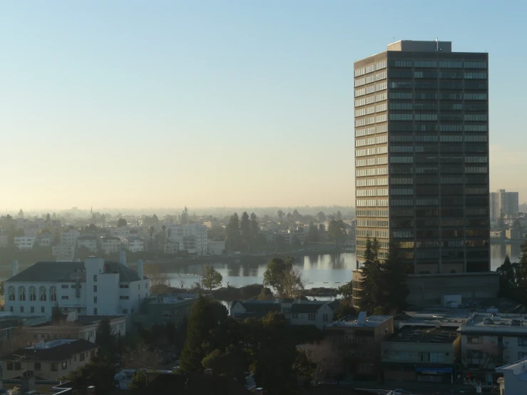 view of a river with buildings and trees near by