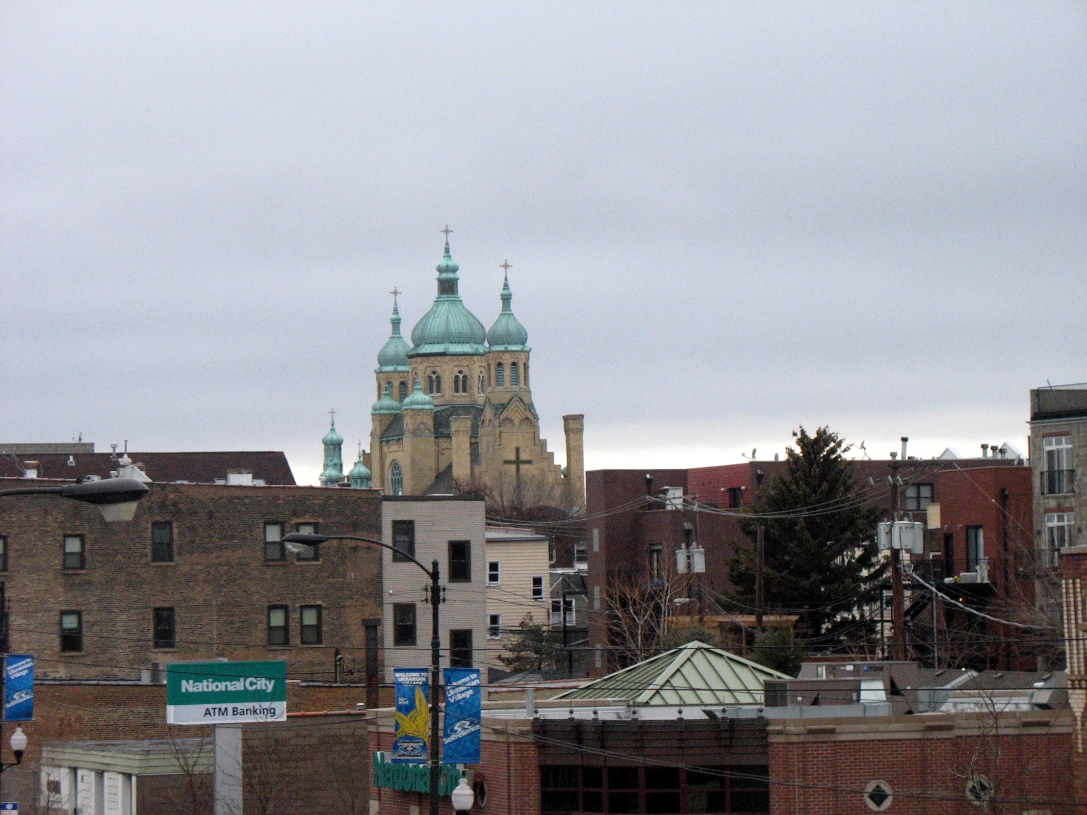 a clock tower with a clock on it is next to some buildings