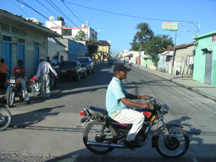 a man is riding a motorcycle through the street