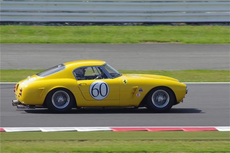 a car driving on a race track with the number 01