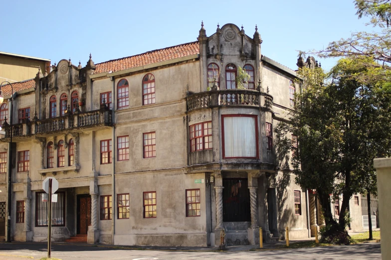 an old building on the corner of a street