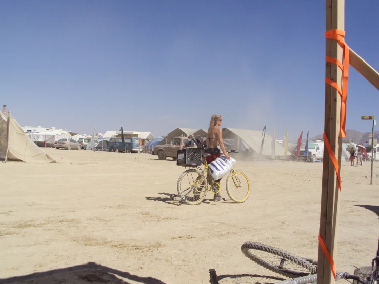 a person on a bike in the sand