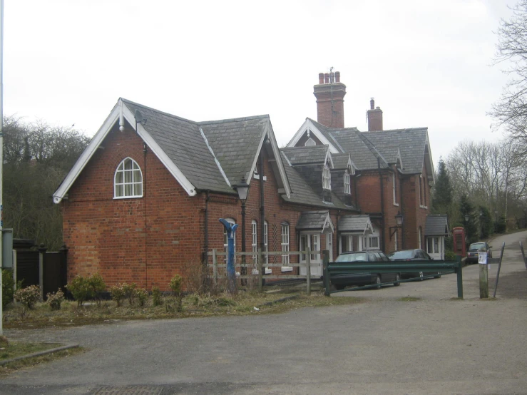 a large brick house with a boat outside