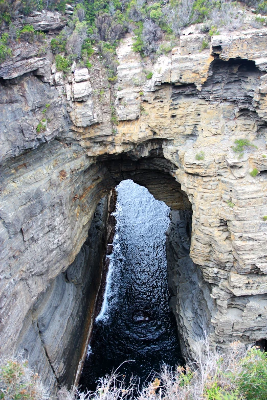 a cave that has been dug deep into the side of a mountain