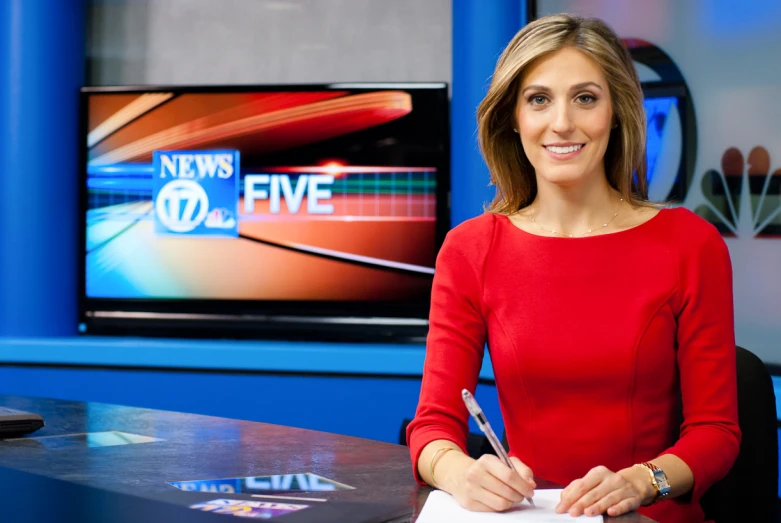 a female news anchor on the news desk